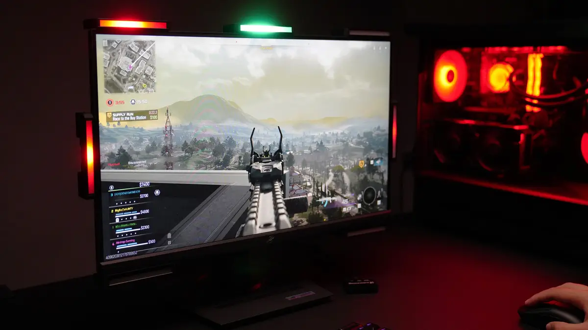 Gaming setup with Audio Radar light bars glowing around the monitor